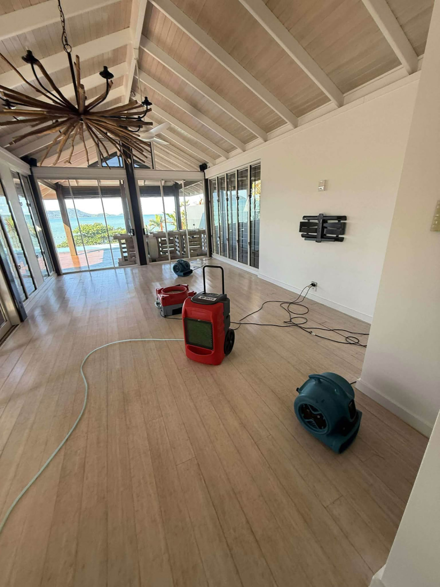 Dehumidifier and air movers drying a coastal home after water damage, Sunshine Coast