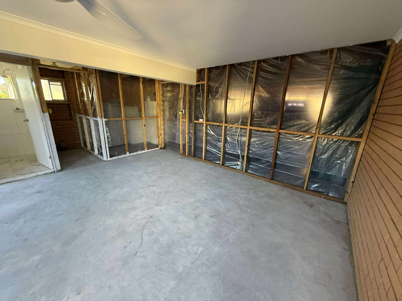 Open-plan strip-out with containment — mould remediation and strip-out Brisbane for homeowners, insurance builders and insurers