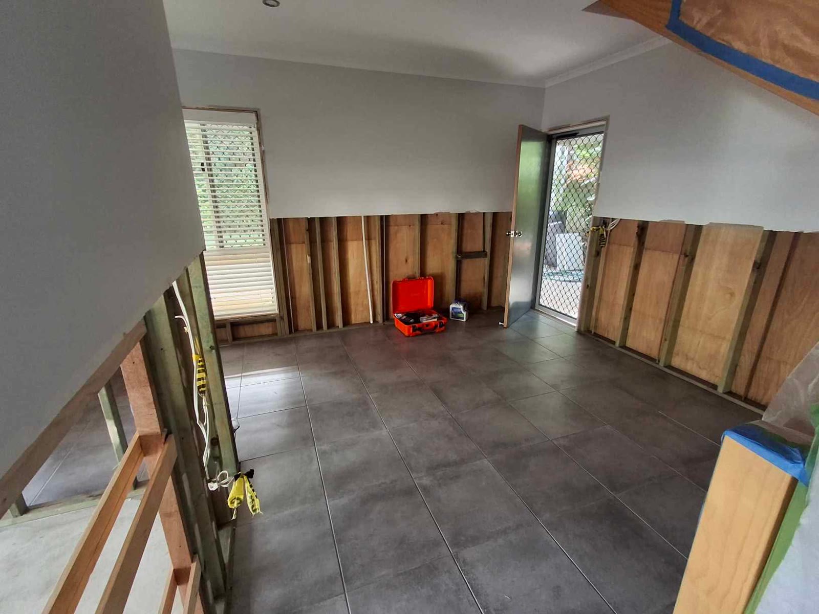 Tiled living area strip-out — mould remediation and strip-out Brisbane for homeowners, insurance builders and insurers
