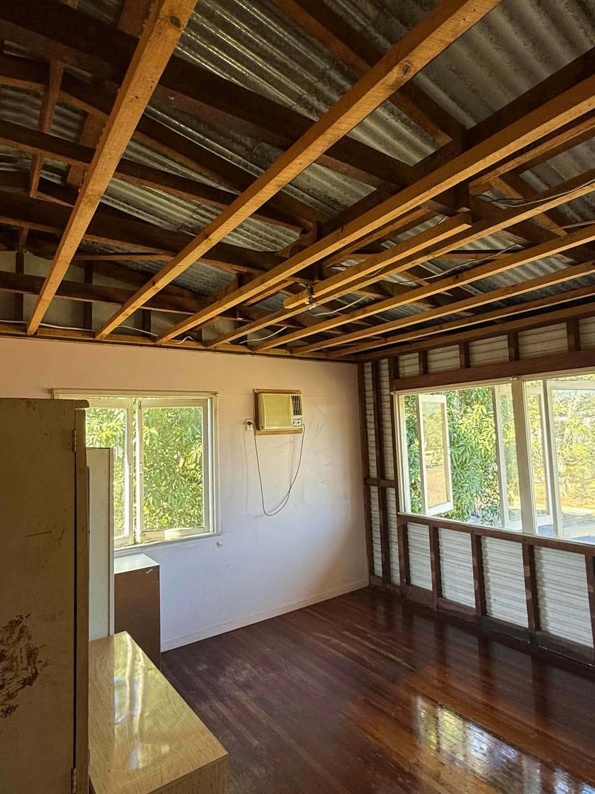 Ceiling removed back to exposed roof rafters in a Queenslander home before relining and painting